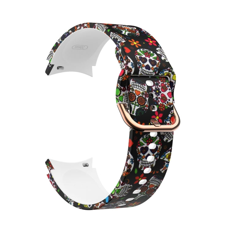 Black silicone smartwatch strap with colorful skull and paw prints, rose-gold buckle