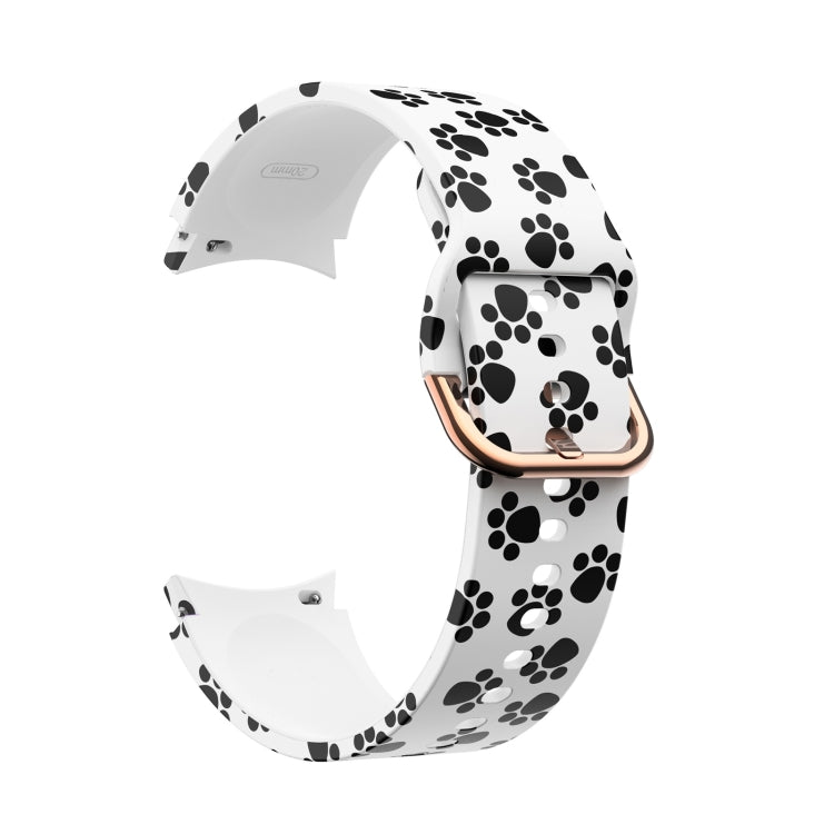 White silicone smartwatch strap with black paw-print pattern and rose-gold buckle