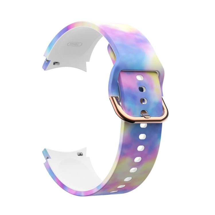Pastel rainbow gradient silicone smartwatch strap with rose-gold buckle and white pin holes