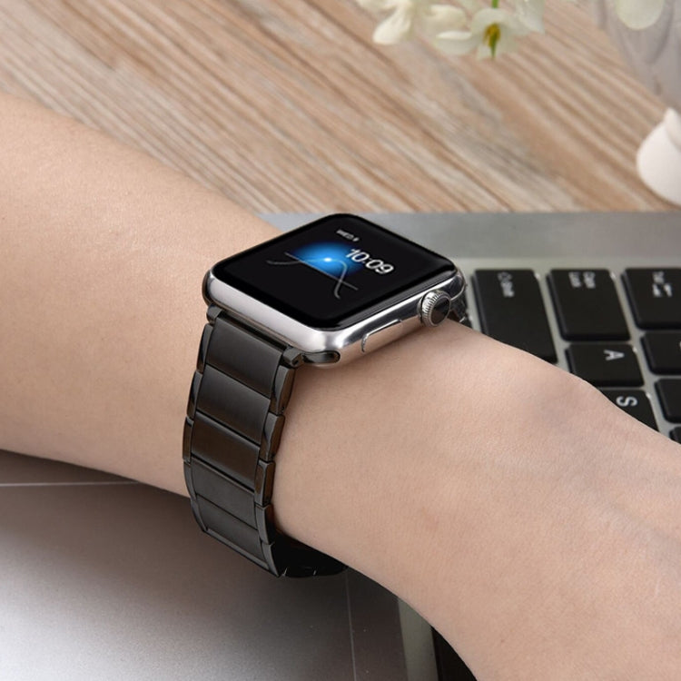 Black magnetic steel watch band worn on wrist with Apple Watch