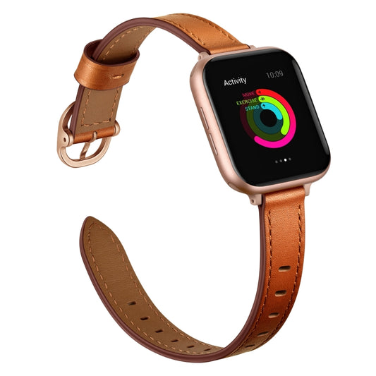Brown leather watch strap with gold buckle, looped end and side strap holes
