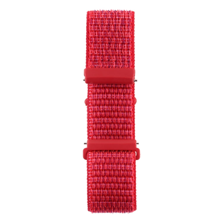 Red nylon watch band with two snap connectors and hook-and-loop fastener, close-up