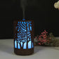 Wooden essential oil humidifier with tree cutout, blue LED glow