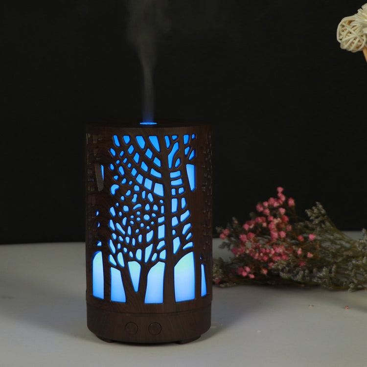 Wooden essential oil humidifier with tree cutout, blue LED glow