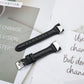 Black leather watchband with metal buckle and stitched strap holes