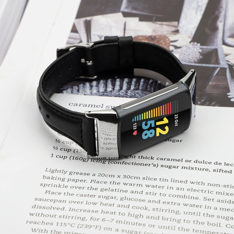 Black leather watchband with silver-tone buckle on a smartwatch