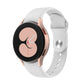 White silicone watch band with reverse buckle and metal pin, shown with watch bezel.