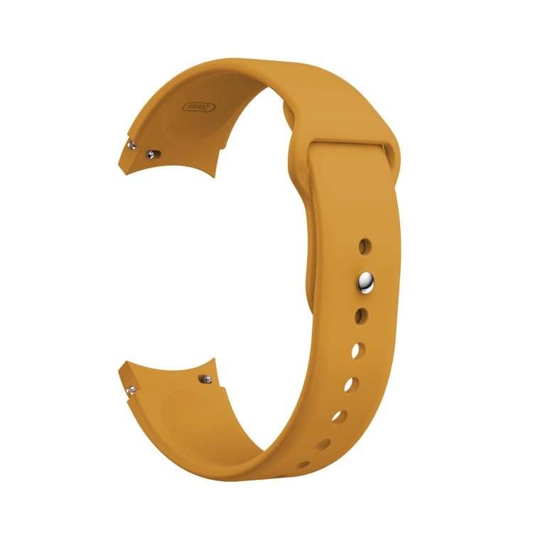 Yellow silicone watch band with reverse buckle, metal pin, and adjustment holes.