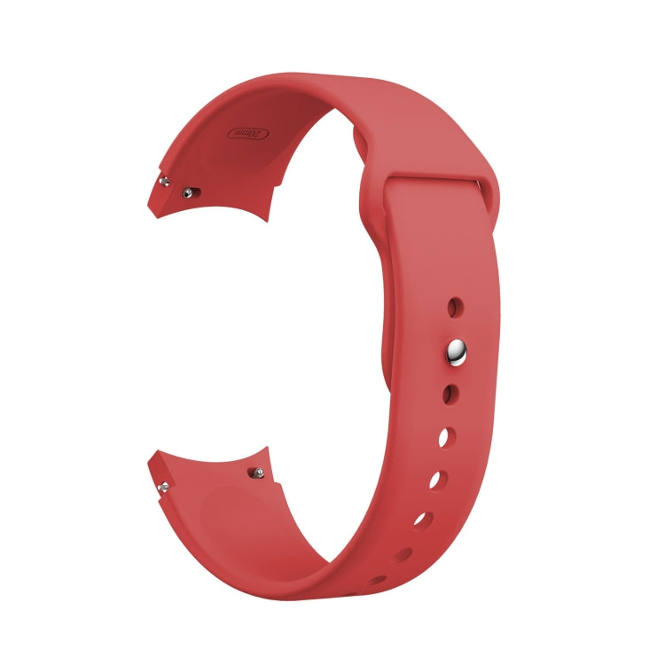 Red silicone watch band with reverse buckle, metal pin, and adjustment holes.