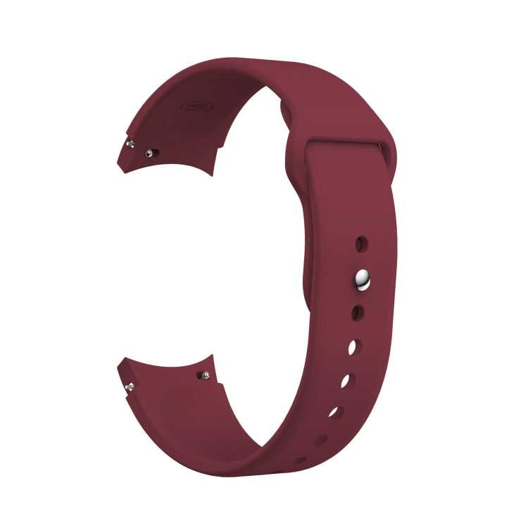 Wine red silicone watch band with reverse buckle, metal pin, and adjustment holes.