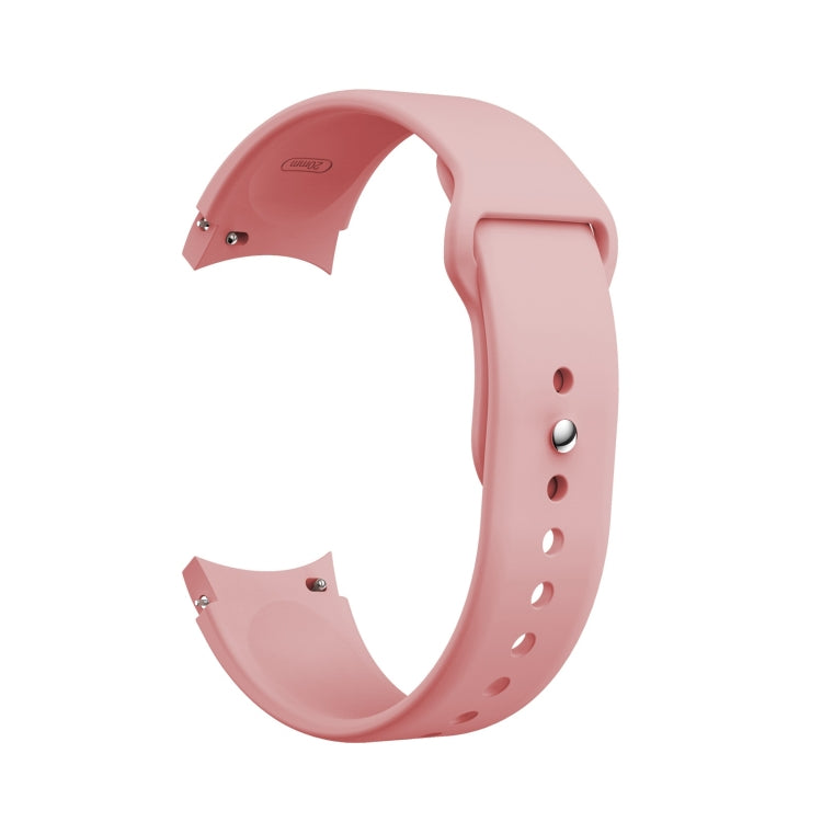 Rose pink silicone watch band with reverse buckle, metal pin, and adjustment holes.