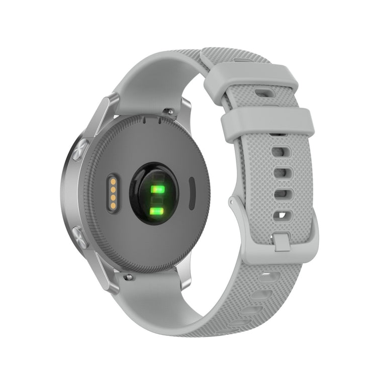 Light gray silicone smartwatch replacement strap with textured perforations and quick-release buckle