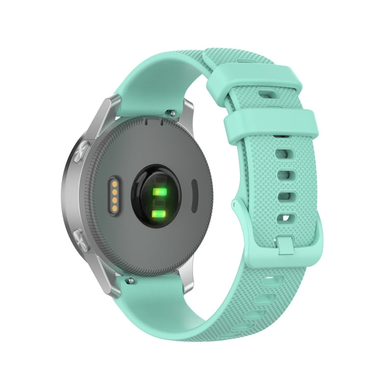 Silicone smartwatch replacement strap in mint green, adjustable clasp with punched strap holes