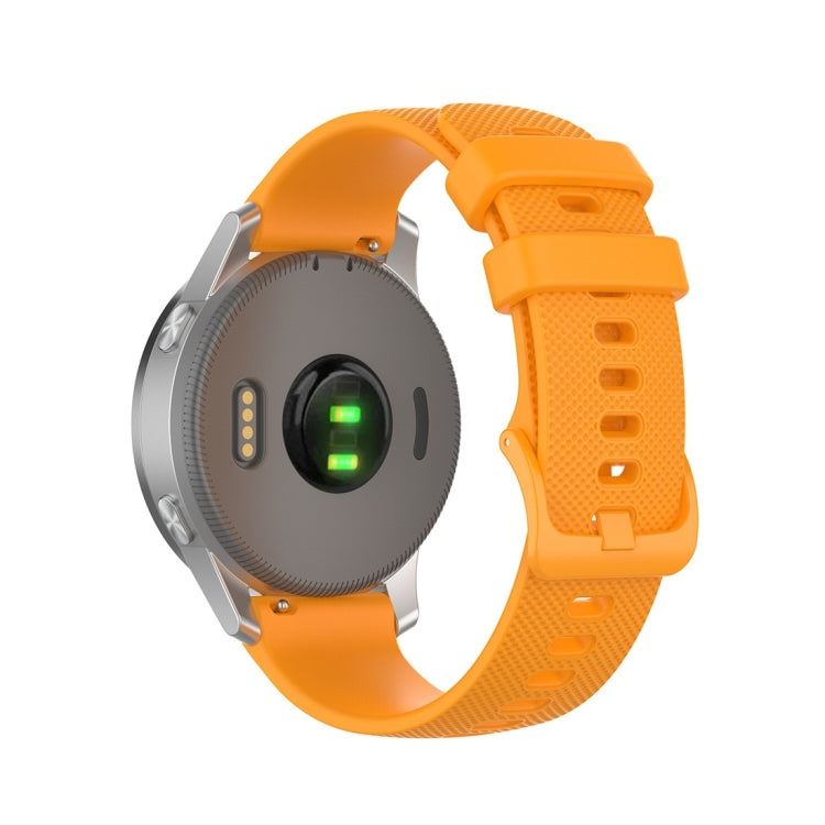 Orange silicone smartwatch strap with textured surface and rectangular clasp