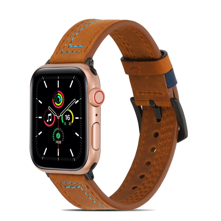 Brown matte leather watch band with blue stitching and perforated strap