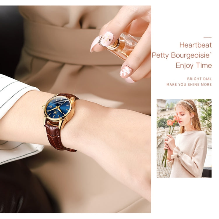 Women's wristwatch with brown leather strap, blue dial, and gold-tone hands