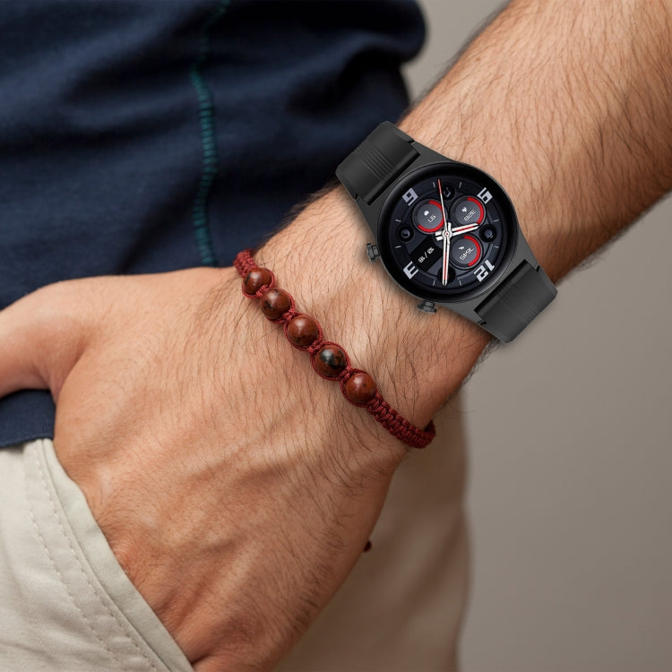 22mm striped silicone watch band, black, on wrist with buckle