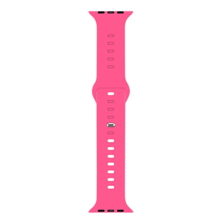 Pink liquid silicone watchband with pin-and-loop buckle and perforation holes.