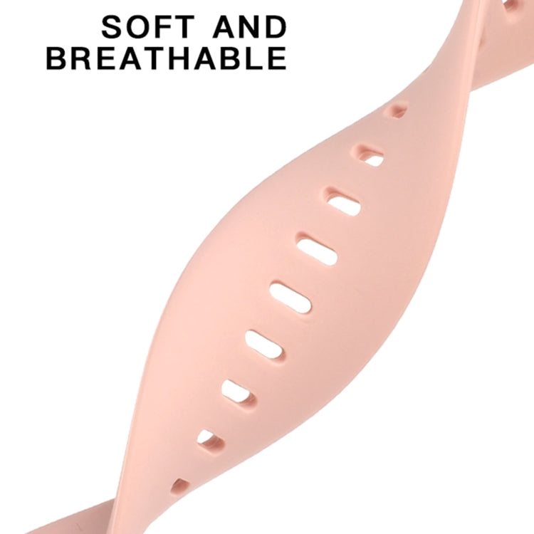 Light pink liquid silicone watchband close-up with oval cutouts and perforation holes.