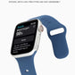 Blue liquid silicone watchband on an Apple Watch, showing buckle and perforation holes.