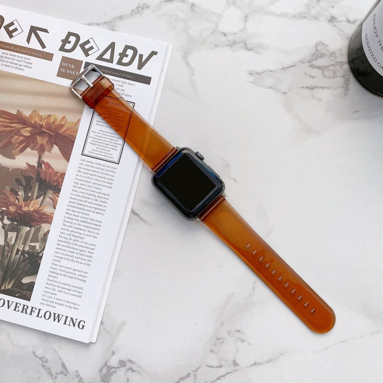 Amber transparent jelly Apple Watch strap with metal buckle and black smartwatch face