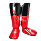 Red Thai boxing shin guards with padded ankle area and black side panels