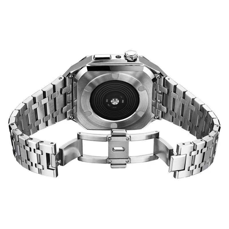 Metal watch case back with round lens, exposed details, silver link bracelet band