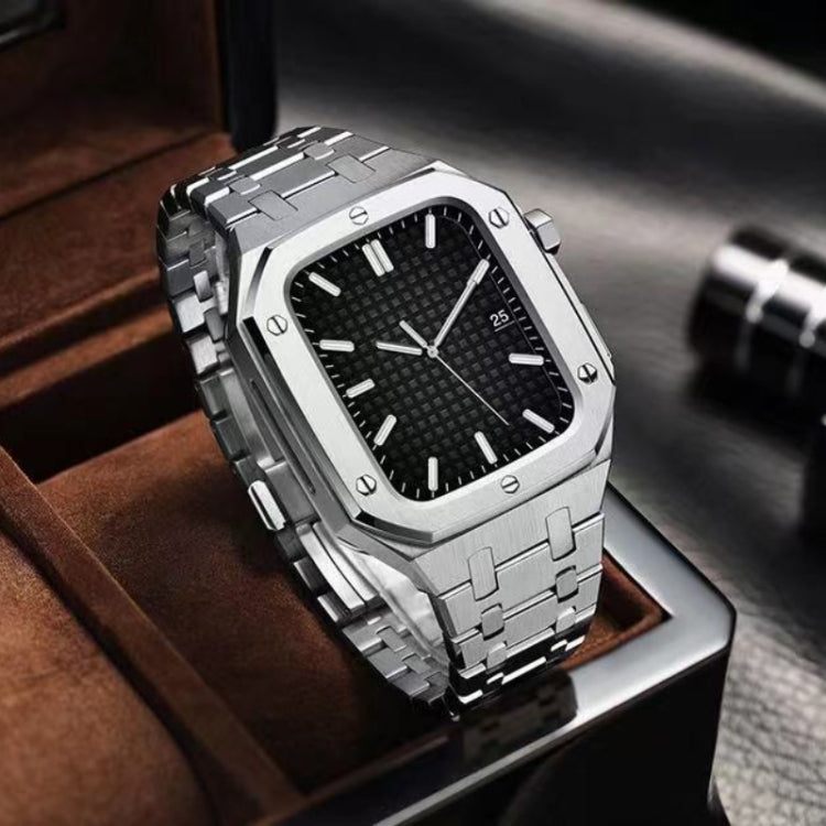 Silver metal watch with black textured dial and integrated link bracelet, angled view