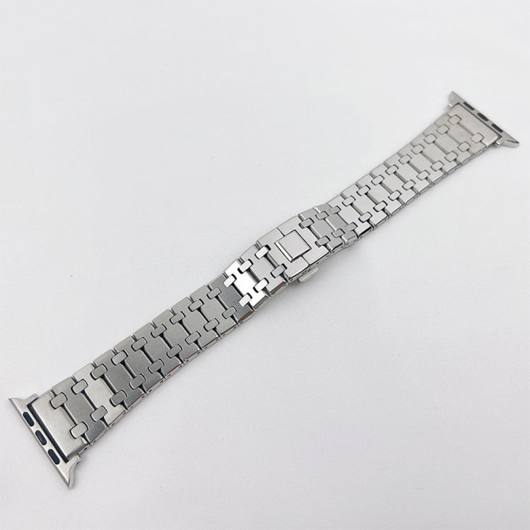 Silver metal link watch band with foldover clasp, straight laid-out view
