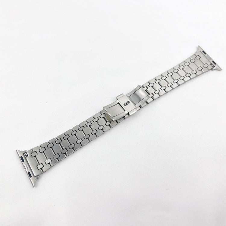 Silver metal link watch band with rectangular clasp centerpiece and side pin holes