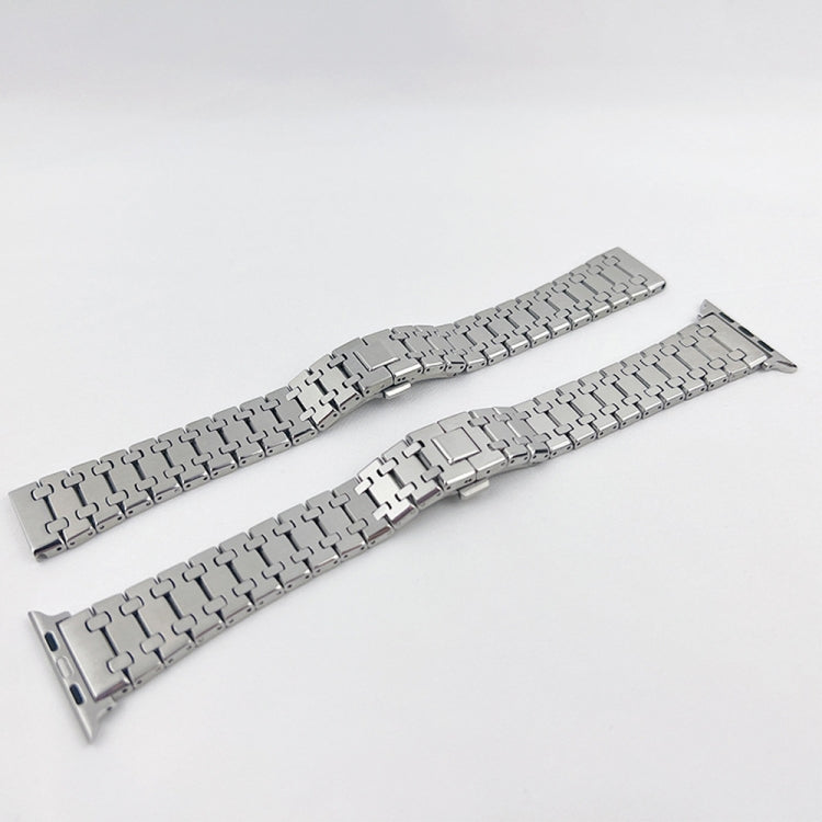 Two silver metal link watch bands side by side with foldover clasps