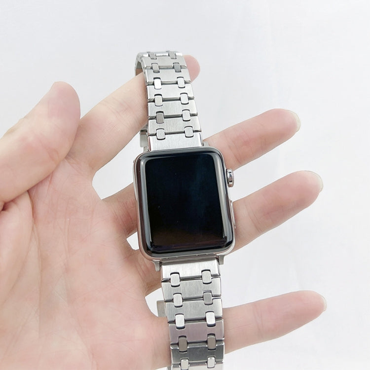 Silver metal link watch band holding a square smartwatch with dark screen