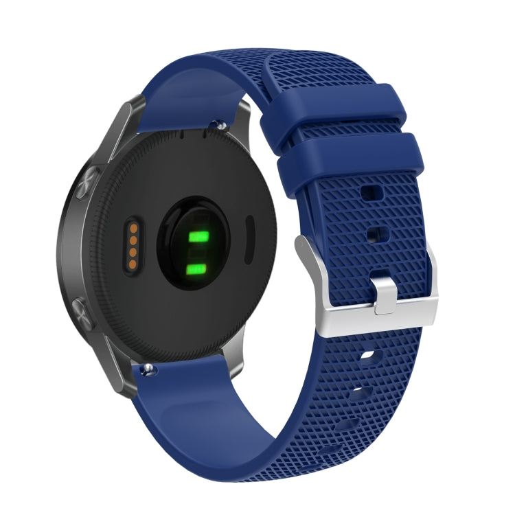 Silicone watch strap with textured pockmarked surface and silver buckle, blue band