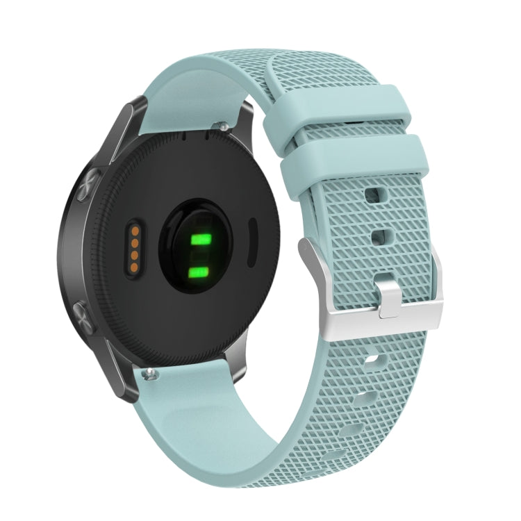 Silicone watch strap with textured pockmarked surface and silver buckle, light blue band