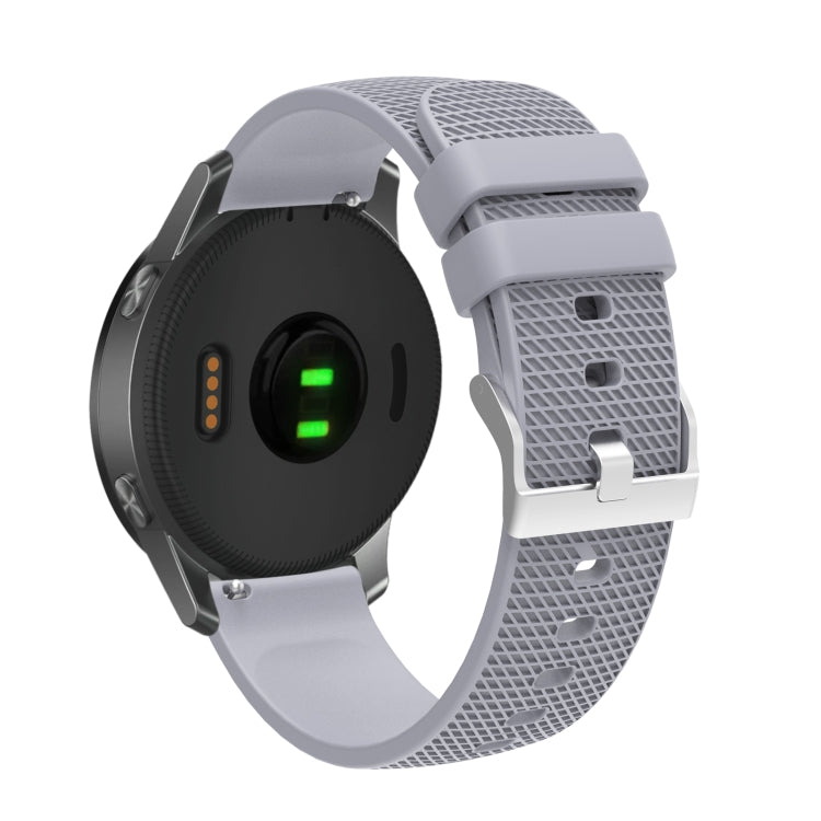 Silicone watch strap with textured pockmarked surface and silver buckle, gray band
