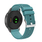 Teal silicone watch strap with silver buckle and pockmarked perforated band