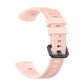 Pink silicone watch strap with ridged texture and adjustable buckle