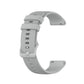 Light gray silicone wristband with textured perforations and adjustable metal clasp