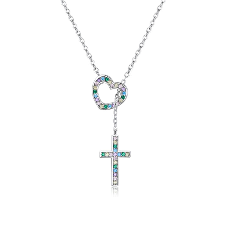 Heart pendant necklace with cross charm, blue and clear stones on silver chain