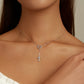 Sterling silver heart pendant and cross charm necklace with blue-green stone accents