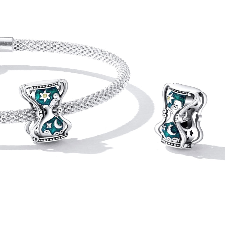 Sterling silver chain bracelet with sun and moon hourglass charm and matching bead