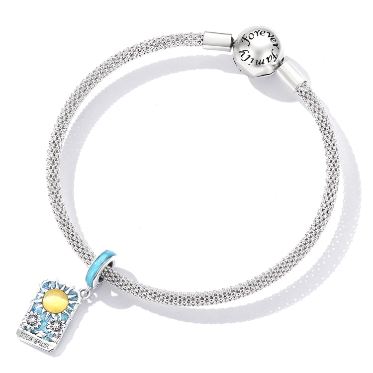 Sterling silver mesh bracelet with blue spacer bead and tarot card sun charm