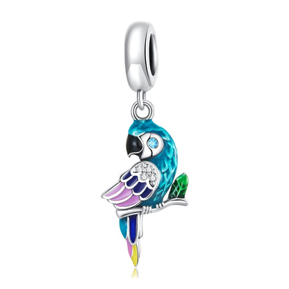 Turquoise and purple parrot enamel pendant charm with crystal-like details and silver loop