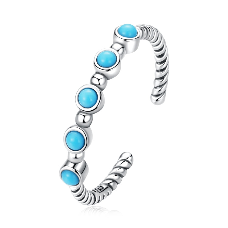 Open sterling silver twist ring with five light-blue turquoise cabochons, bead-set ends