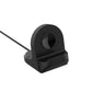Black dock cradle with circular charging port opening