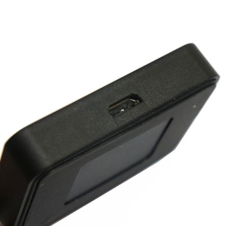 Black watch charger base side view with charging port and button detail.