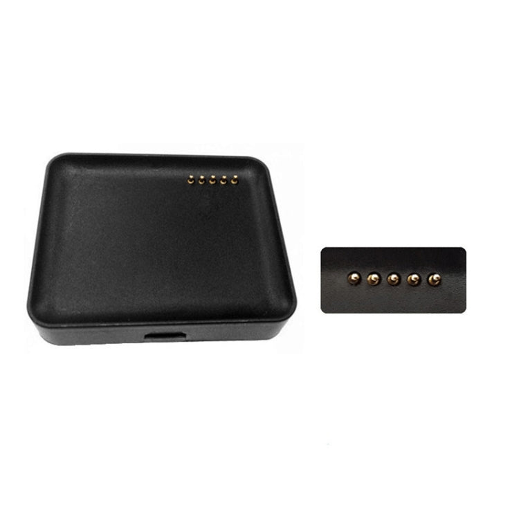 Black watch charging dock with pin contacts and matching side port.