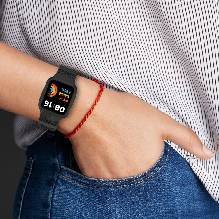 Black silicone smartwatch band worn on wrist, adjustable clasp visible.