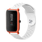 Orange silicone breathable watch strap with perforations and attached smartwatch body