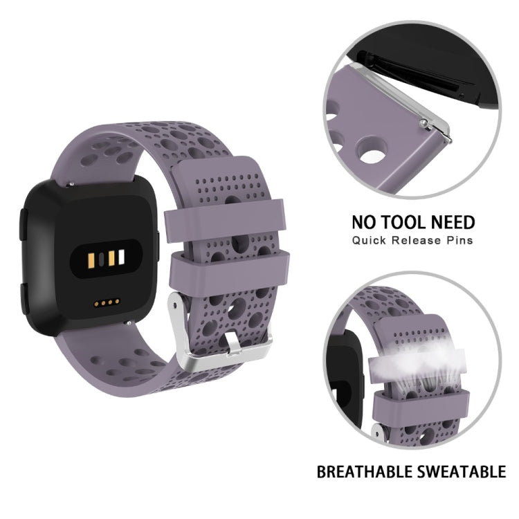 Breathable perforated TPU watch strap with quick-release for Fitbit Versa, light purple.
